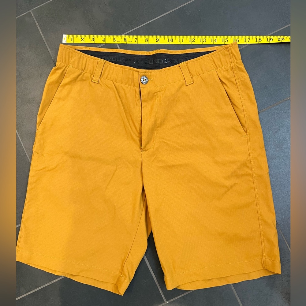 Under Armour Heat Gear Shorts, size 34, 10” inseam, Color is a mustard/camel.